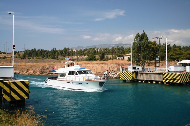 Corinth Canal - Pleasure craft sailing over the submerged bridge
